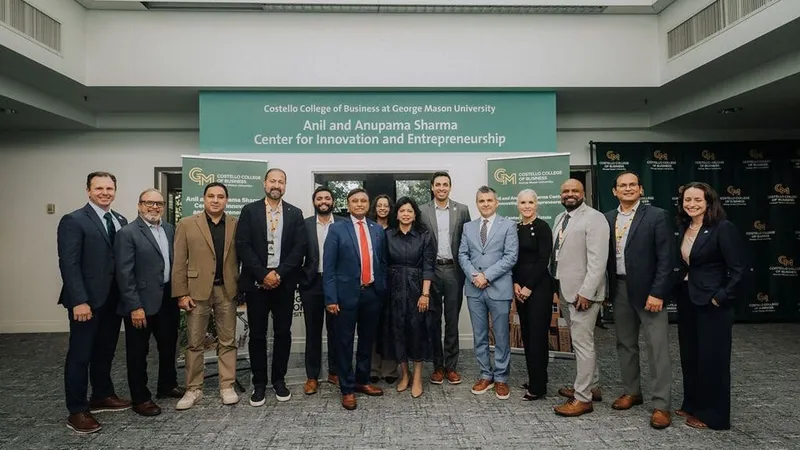 Thirteen people stand beneath a George Mason University entrepreneurship center sign.