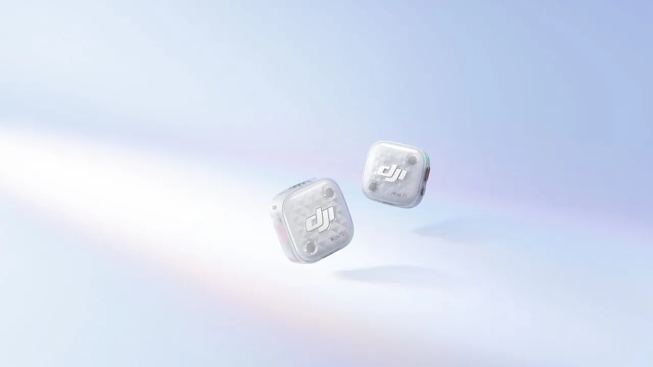 Two DJI Mic Mini transmitters floating against a pale blue background.