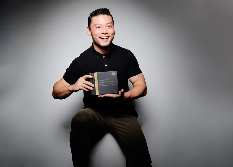 Douglas Yu holds a box of Diamond Brew Coffee craft espresso.