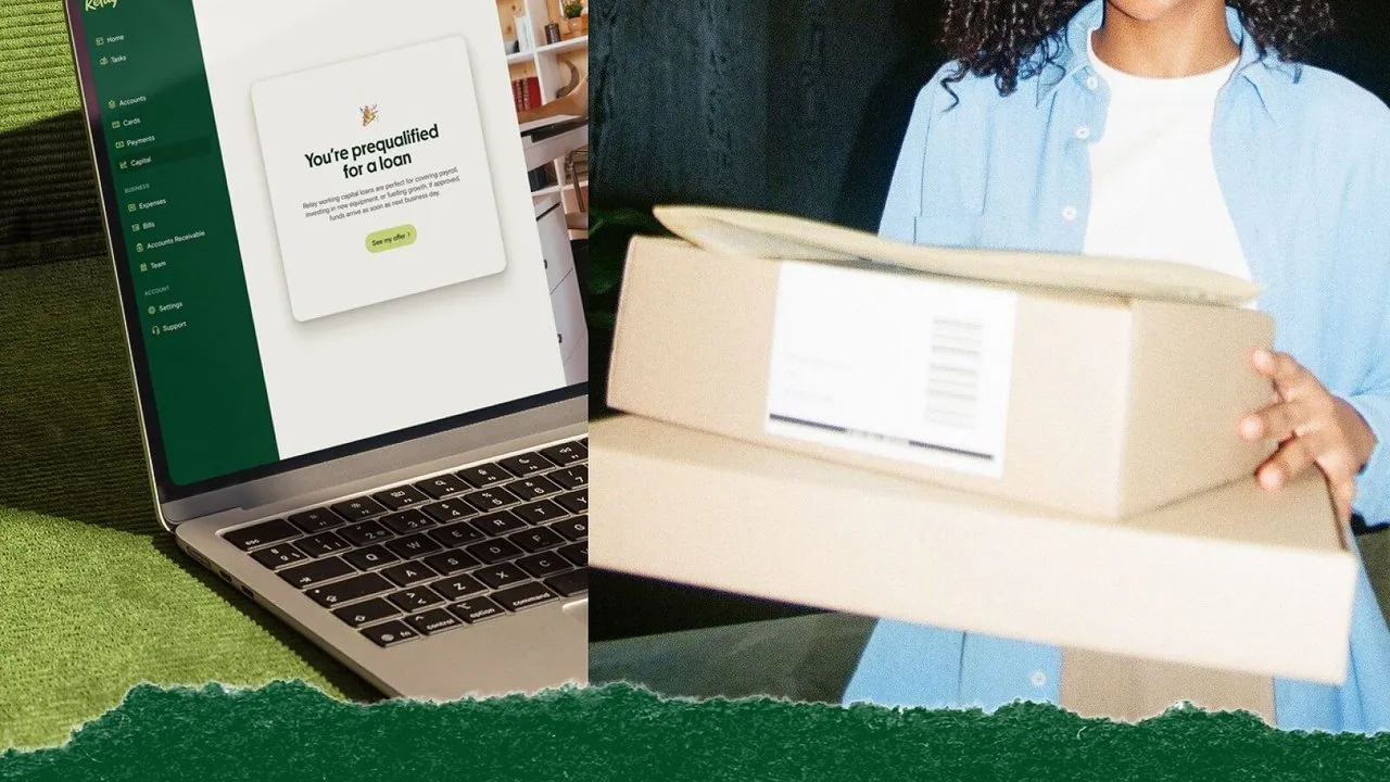 Laptop displaying a loan prequalification message beside a person holding two cardboard shipping boxes
