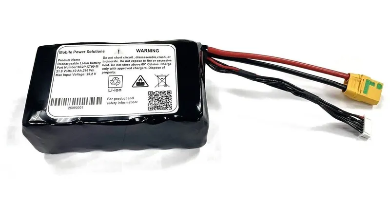 A black lithium-ion battery pack with red and black cables and yellow connector