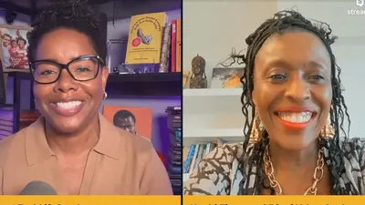 Two women smiling during a split-screen video interview, with bookshelves and artwork behind them.