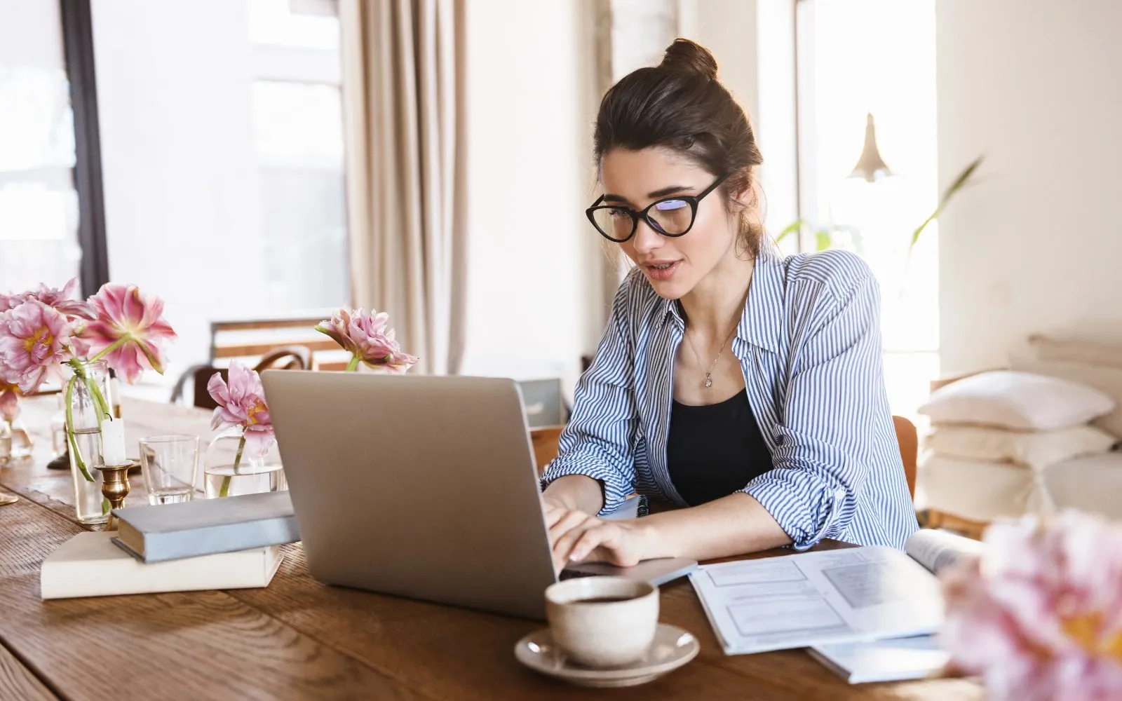 A woman working on her laptop at home