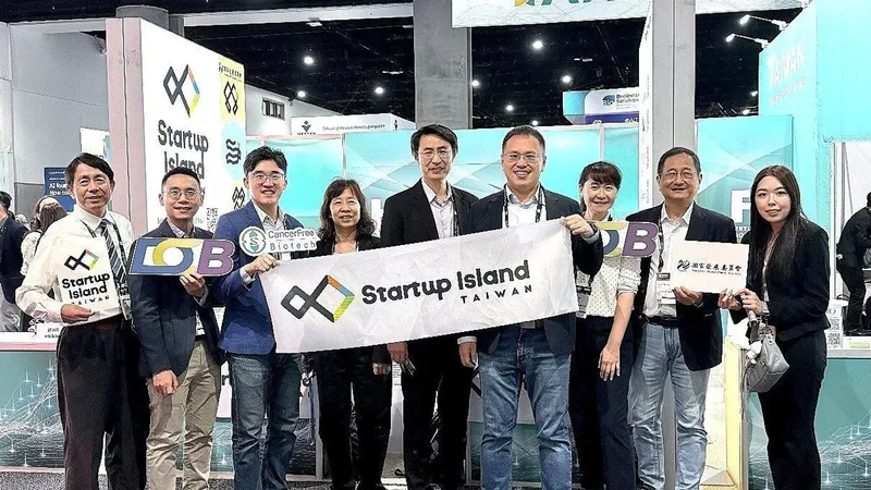 Eight people holding a Startup Island Taiwan banner and company signs at an exhibition booth.